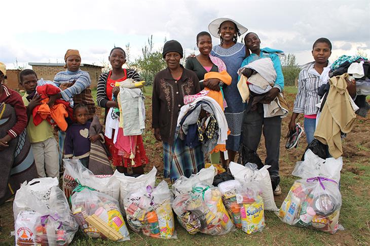 Giving food packages to the Orphans